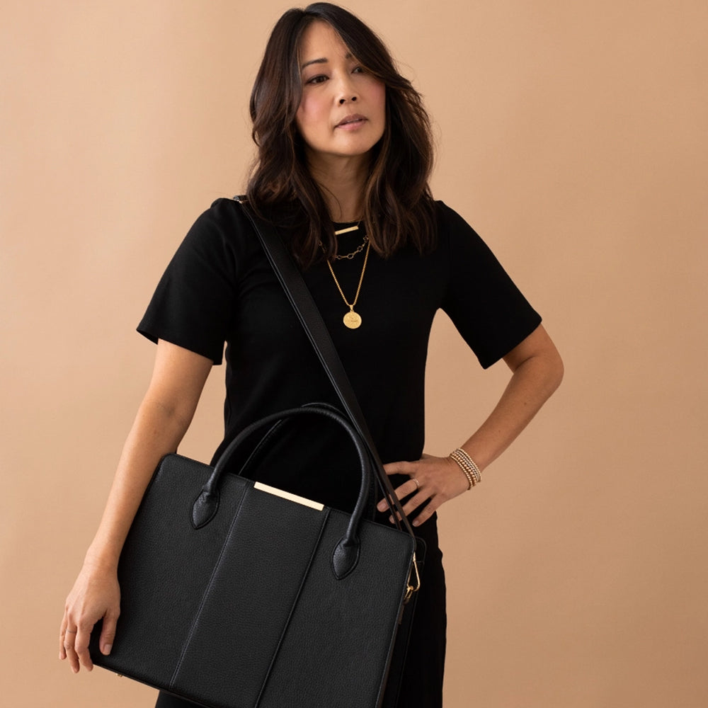 Black work tote bag with gold accents